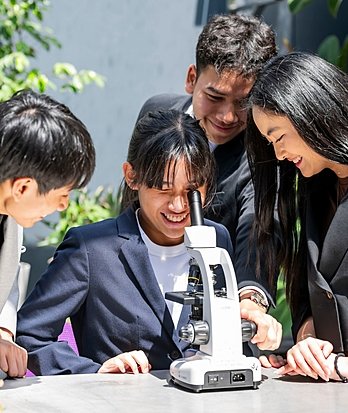Pupils studying Biology in the lab, part of Sixth Form science education at Brighton College Vibhavadi.