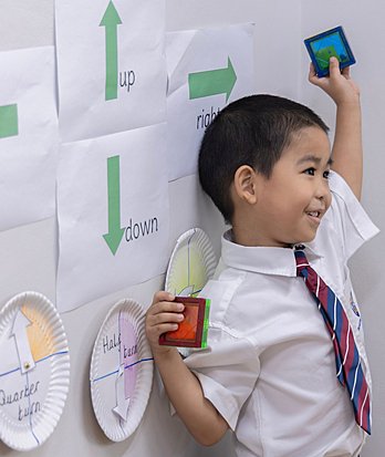 Pupils exploring new concepts and enjoying meaningful classroom experiences through a British curriculum education.