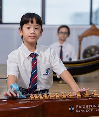 Primary pupils participating in classroom lessons and building knowledge across different subjects at a British school in Bangkok.