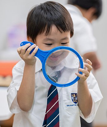 Pupils learning together in the classroom while developing academic skills, curiosity, and confidence through a holistic approach to education.