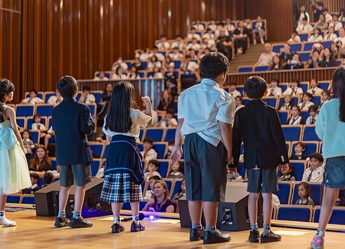  Happy Prep pupils performing on stage at Brighton College Vibhavadi, celebrating learning at a top international school in Bangkok 