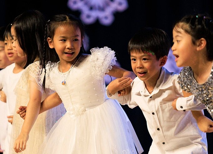  Young Prep pupils showcasing confidence through stage performance at Brighton College Vibhavadi 