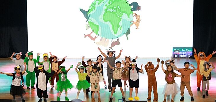  KS1 pupils taking the audience on an exciting journey around the world through an animal-themed assembly at Brighton College Bangkok Vibhavadi 
