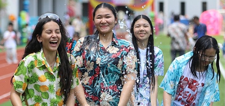  Pupils enjoying a vibrant Songkran celebration at a British international school in Bangkok, embracing Thai traditions together. 