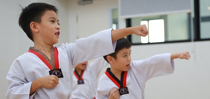  Pupils learning from Coach Choi Young Seok during a special sports coaching session at a British international school in Bangkok. 
