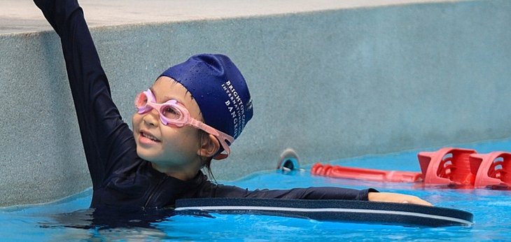  Year 1 and Year 2 pupils building confidence and resilience during the KS1 Swim Gala at a British international school. 