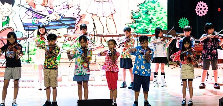  Year 5 and Year 6 pupils showcasing their musical talents during Splash of Sound at a British school in Bangkok. 