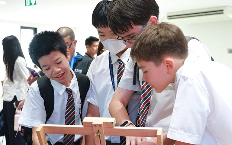  Pupils sharing their artwork and creative ideas during an inspiring Art Exhibition that celebrates collaboration and creative learning. 