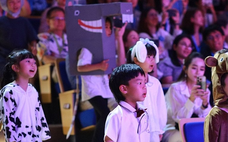  Key Stage 1 pupils sharing their creativity and imagination through the fun and energetic Oink! school production. 