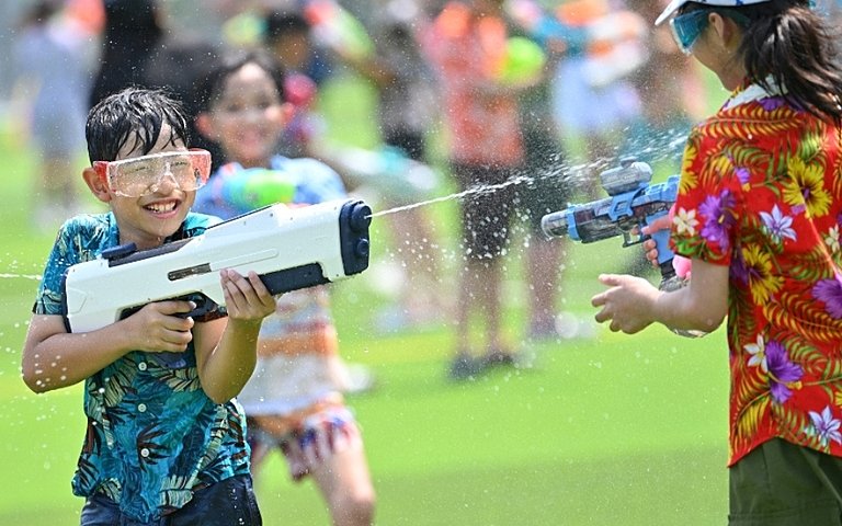  Pupils taking part in Songkran activities that encourage cultural understanding and community spirit. 