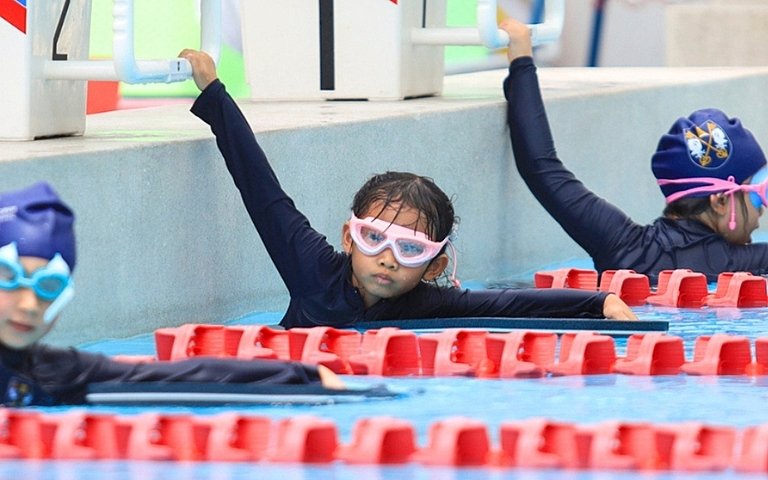  Prep School pupils taking part in the KS1 Swim Gala, celebrating achievement and active learning. 