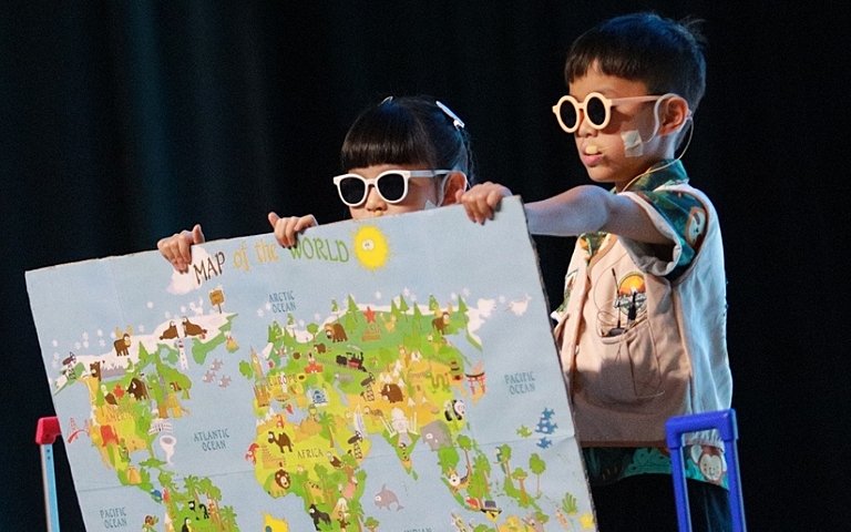  KS1 pupils developing confidence and communication skills through an energetic animal-themed performing arts assembly. 