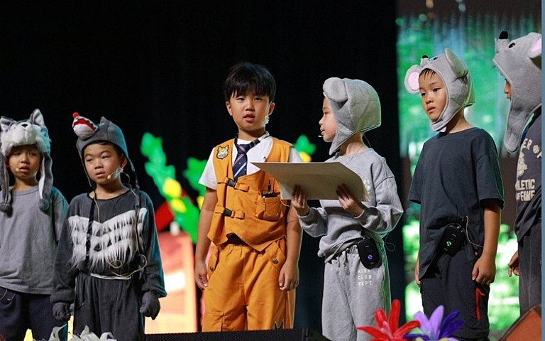  Key Stage 1 pupils developing confidence and creativity through their lively Oink! performing arts production. 