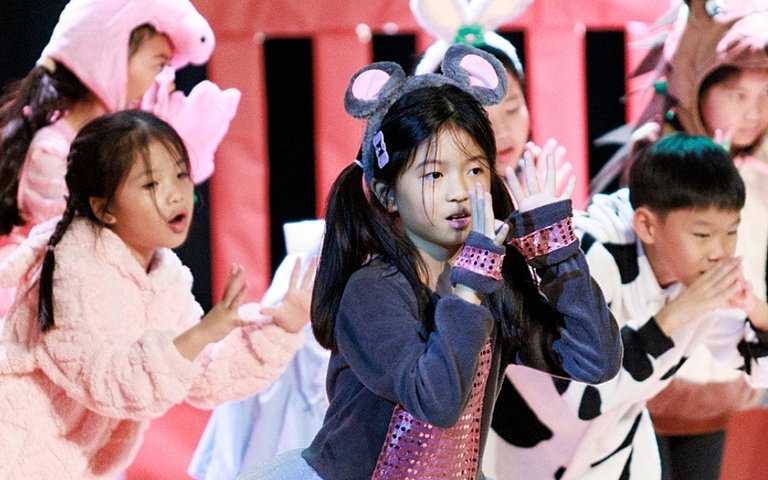  Pupils showcasing creativity and collaboration during the Year 3 & 4 Peter Rabbit performance. 