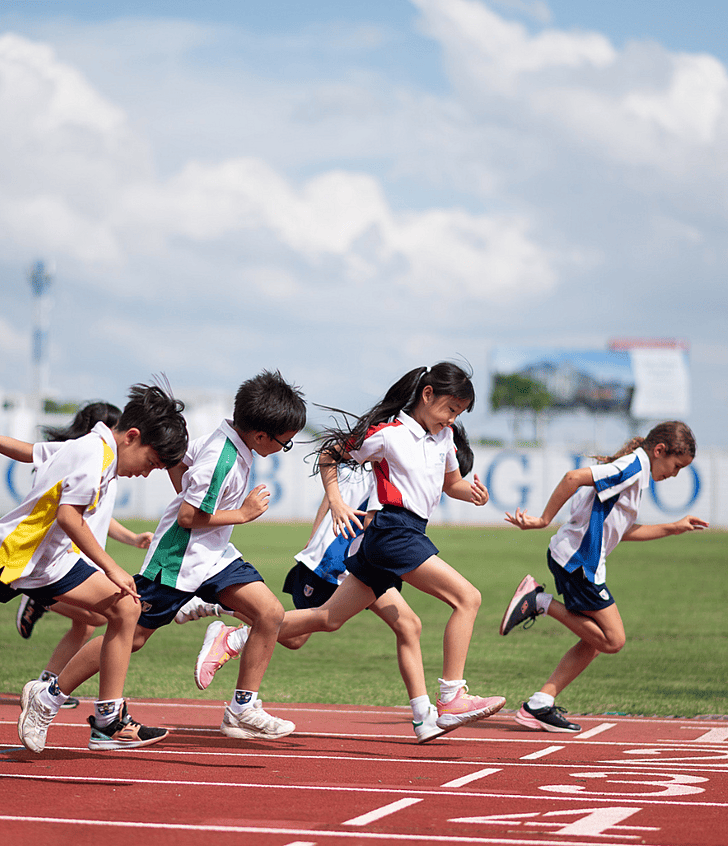 Pupils racing on the track during Open House at Brighton College Krungthep Kreetha, showcasing active and engaging school life in Thailand. 
