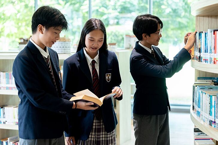 Pupils reading in the senior school library at Brighton College Vibhavadi, developing independent study habits in a premium international school. 