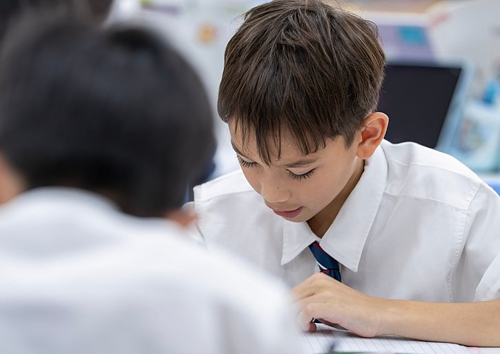  Pupil enjoying reading independently at Brighton College Vibhavadi, showcasing learning at a leading international school in Bangkok 
