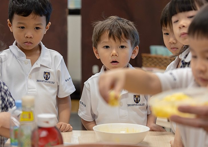  Pupils laughing and learning together in class at Brighton College Vibhavadi, one of the top international schools in Thailand 