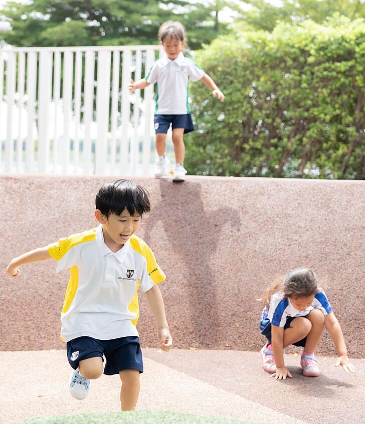  Pupils playing in the playground at Brighton College Vibhavadi, enjoying active exploration beyond the classroom. 
