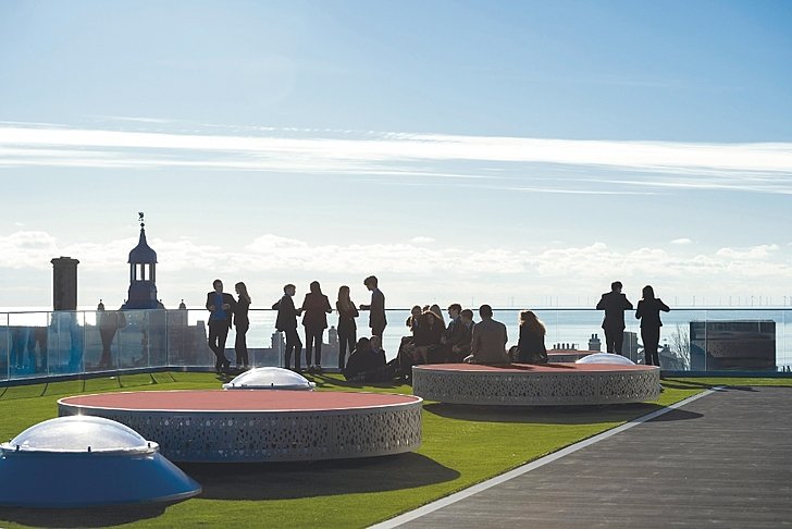  Sixth Form pupils relaxing on the rooftop at Brighton College Vibhavadi, enjoying moments of connection and wellbeing beyond the classroom. 