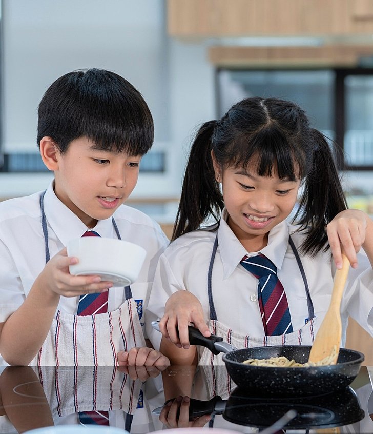  Smiling pupils focused on their studies in the classroom at a top international school in Bangkok 